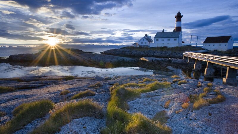 Lighthouse on Rocky Shore — Blue, Serene, Sunrise