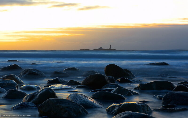 Lighthouse on Rocky Shore — Blue, Serene, Sunset, Photograph, Rocks, Ocean, Sky