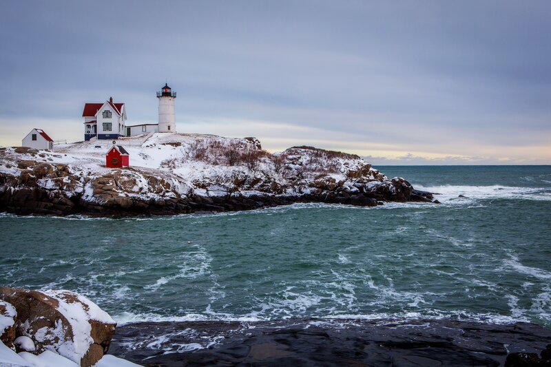 Lighthouse on Rocky Shore — Blue, Serene, Winter