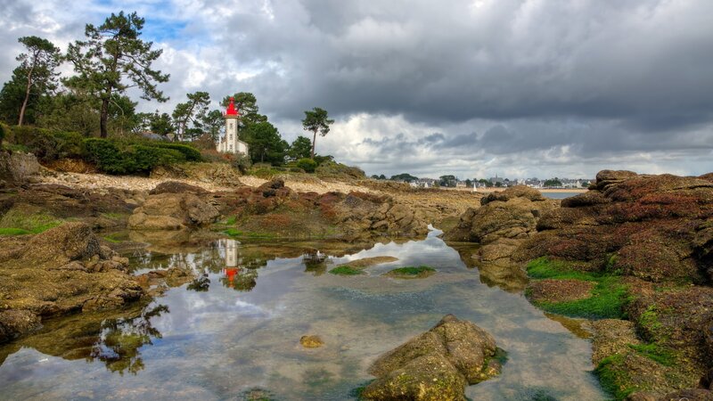 Lighthouse on Rocky Shore — Gray, Dramatic, Afternoon