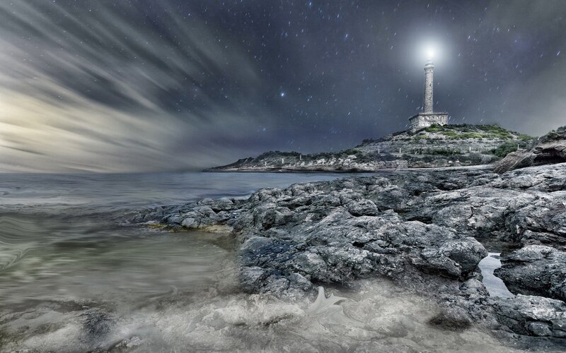 Lighthouse on Rocky Shore — Gray, Dramatic, Night, Photograph