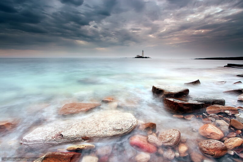 Lighthouse on Rocky Shore — Gray, Dramatic, Sunset, Photograph, Rocks, Sea, Clouds