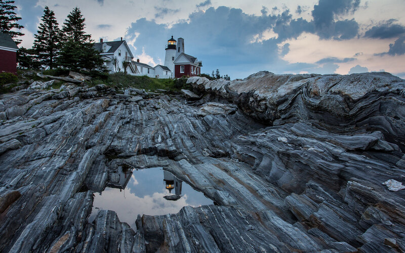 Lighthouse on Rocky Shore — Gray, Dramatic, Sunset, Photograph