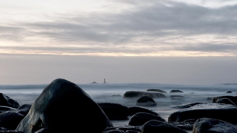 Lighthouse on Rocky Shore — Gray, Serene
