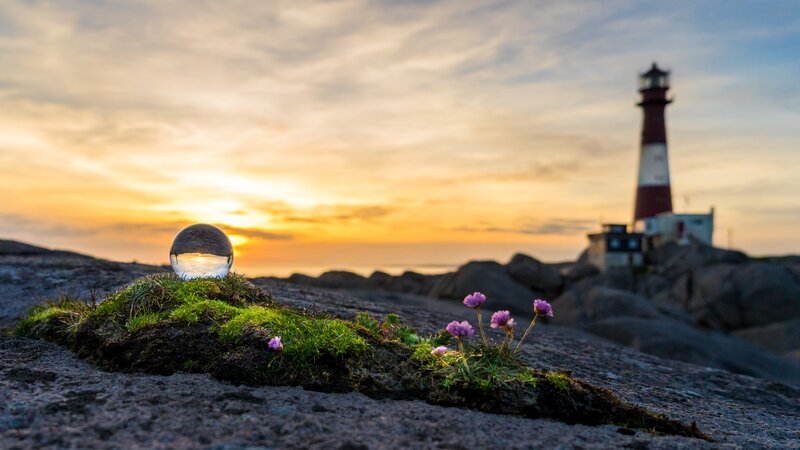 Lighthouse on Rocky Shore — Orange, Serene, Sunset, Photograph, Crystal Ball