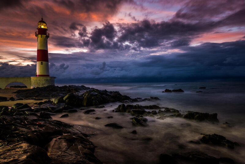 Lighthouse on Rocky Shore — Purple, Dramatic, Sunset, Photograph, Clouds