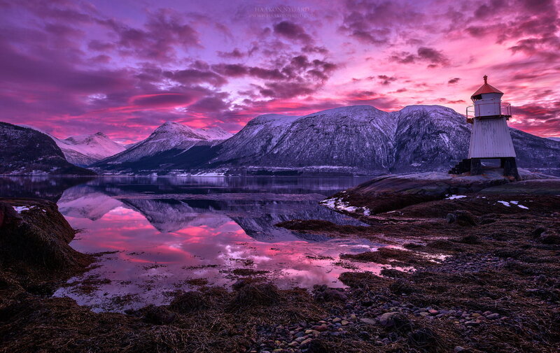 Lighthouse on Rocky Shore — Purple, Dramatic, Sunset, Photograph, Mountains