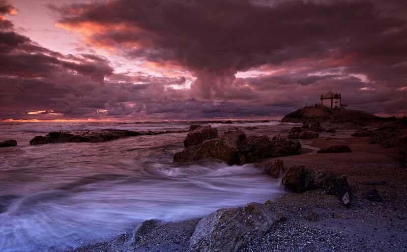 Lighthouse on Rocky Shore — Purple, Dramatic, Sunset, Photograph