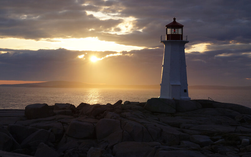 Lighthouse on Rocky Shore — White, Dramatic, Sunset, Photograph