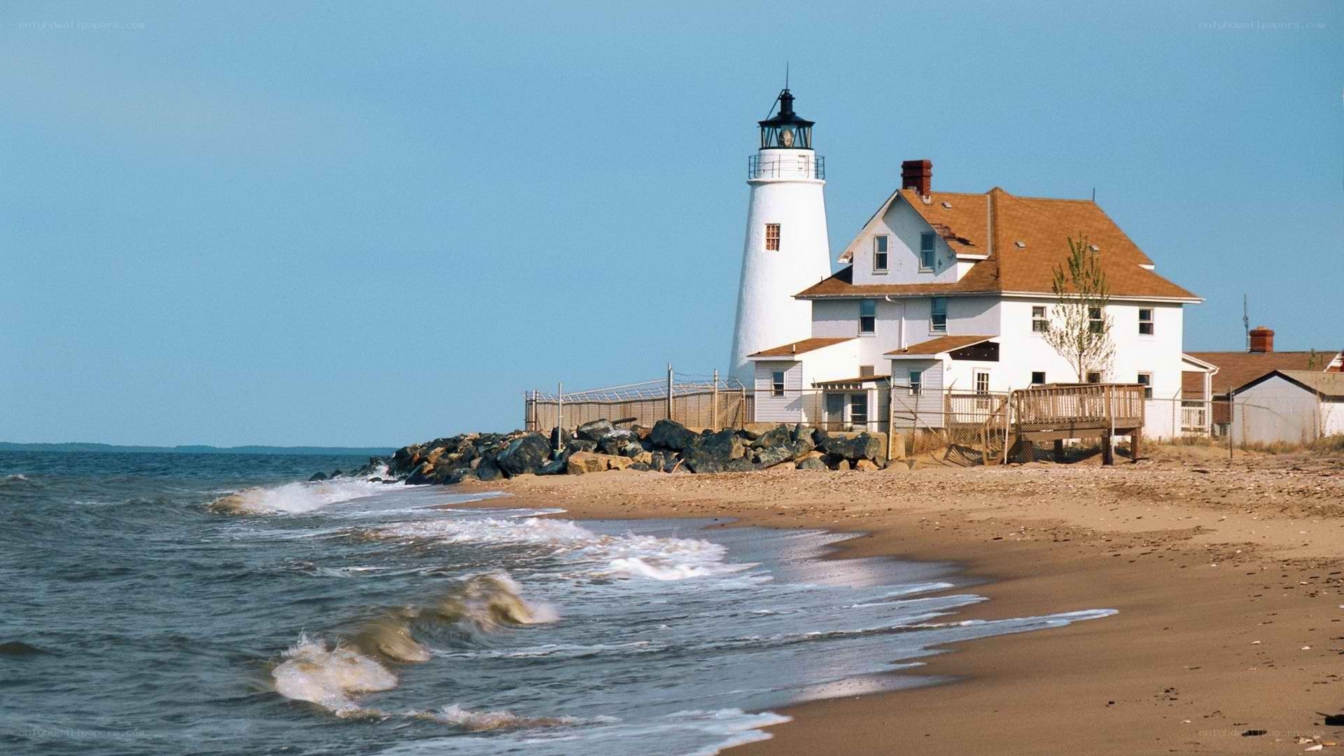 lighthouse on sandy beach