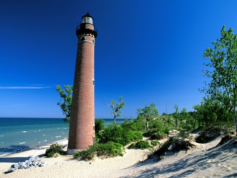 Lighthouse on sandy beach