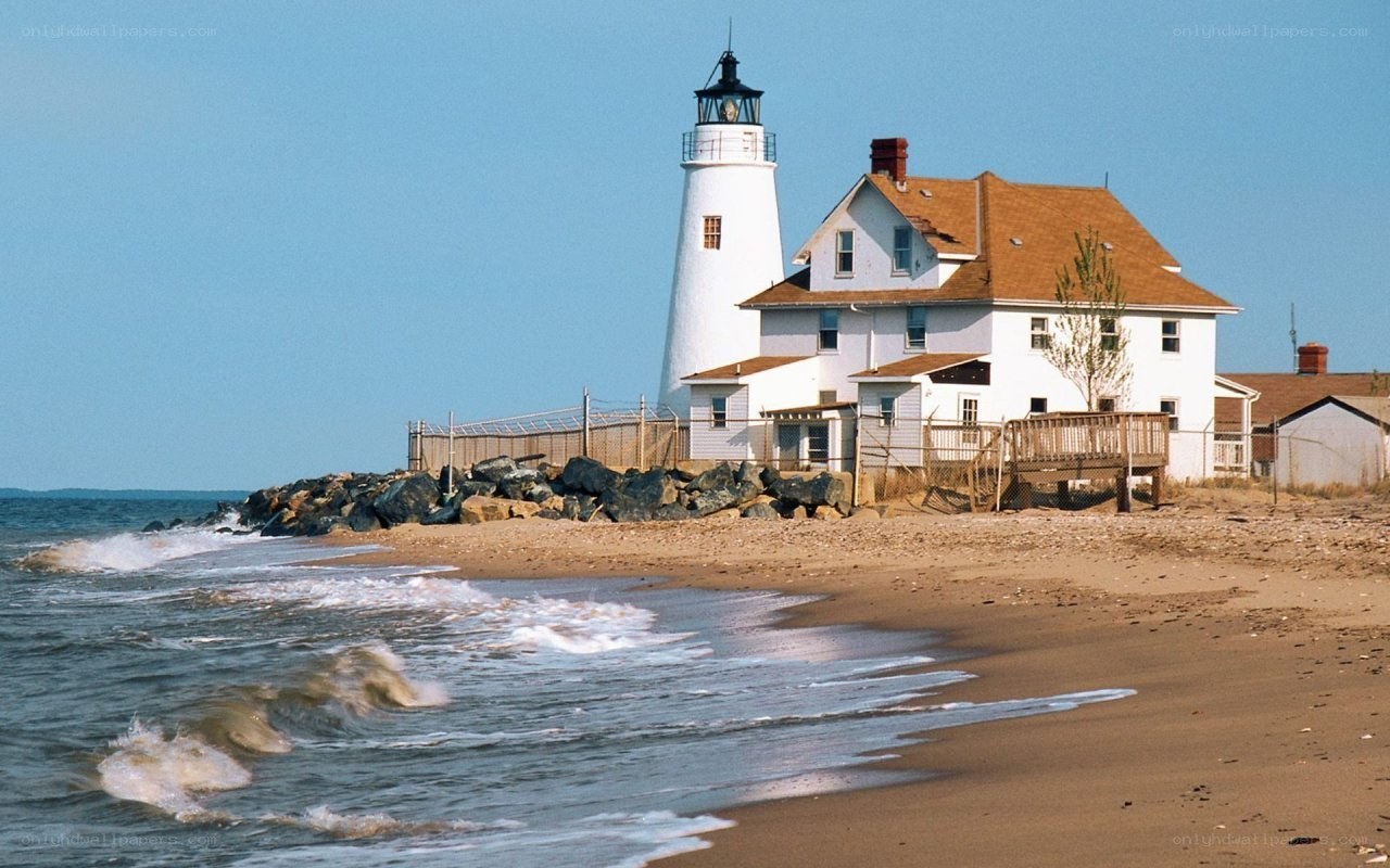 lighthouse on sandy beach