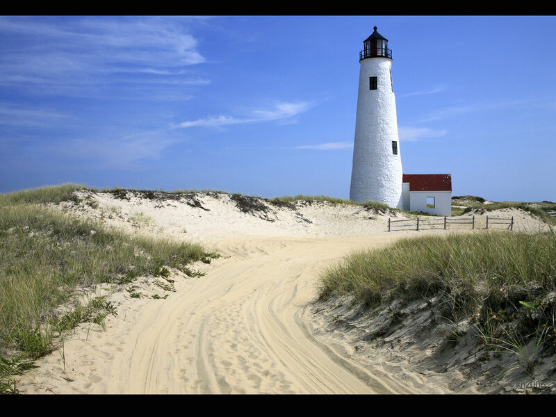 Lighthouse on sandy dunes