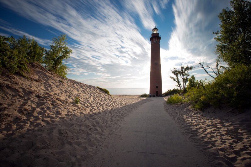 Lighthouse on Sandy Path
