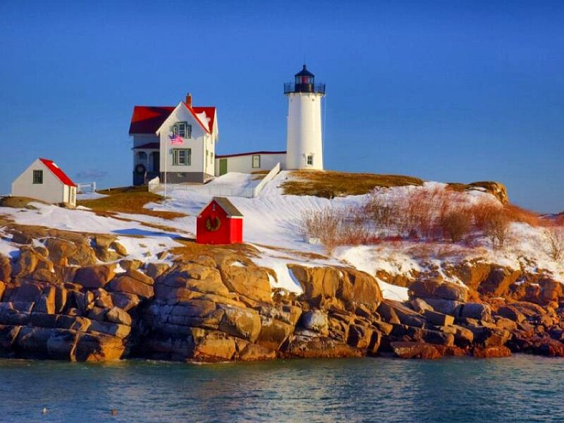 lighthouse on snowy coast