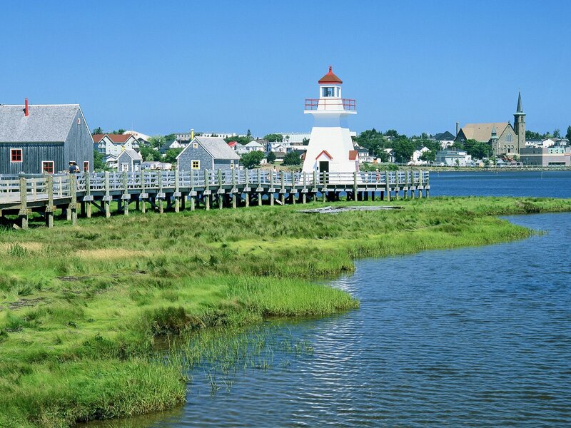 Lighthouse on Wooden Pier — Blue, Serene, Afternoon, Photograph