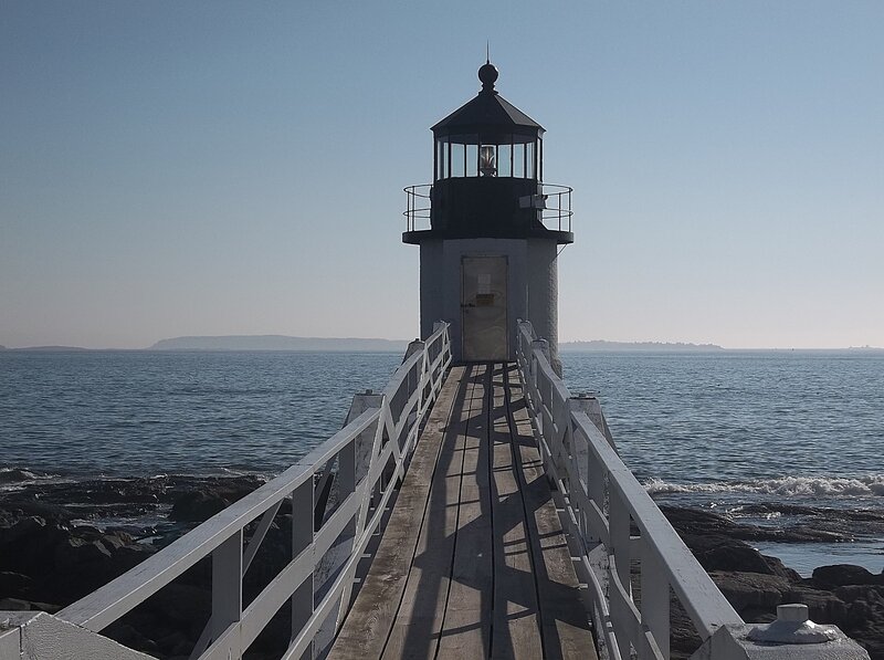 Lighthouse on Wooden Pier — Blue, Serene, Afternoon
