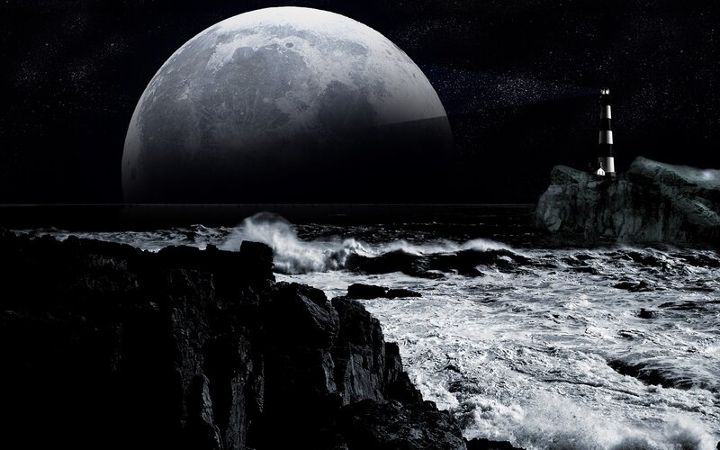 Lighthouse under giant moon