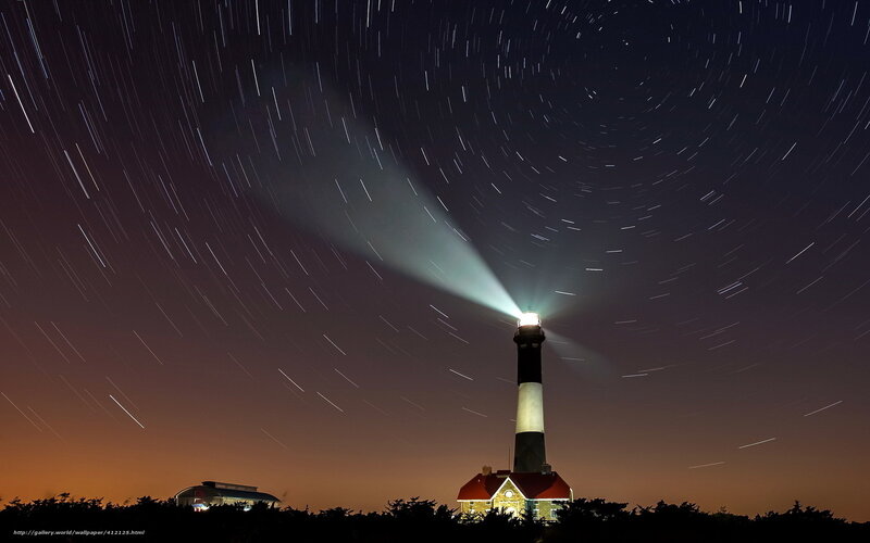 Lighthouse under star trails