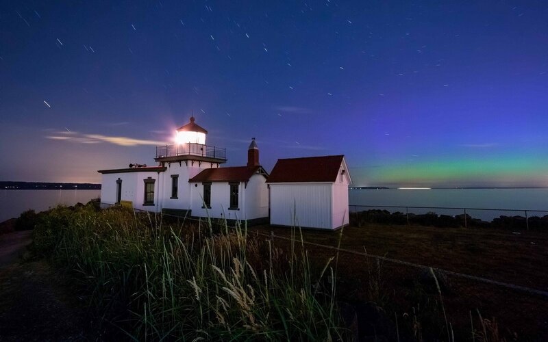 Lighthouse under starry sky