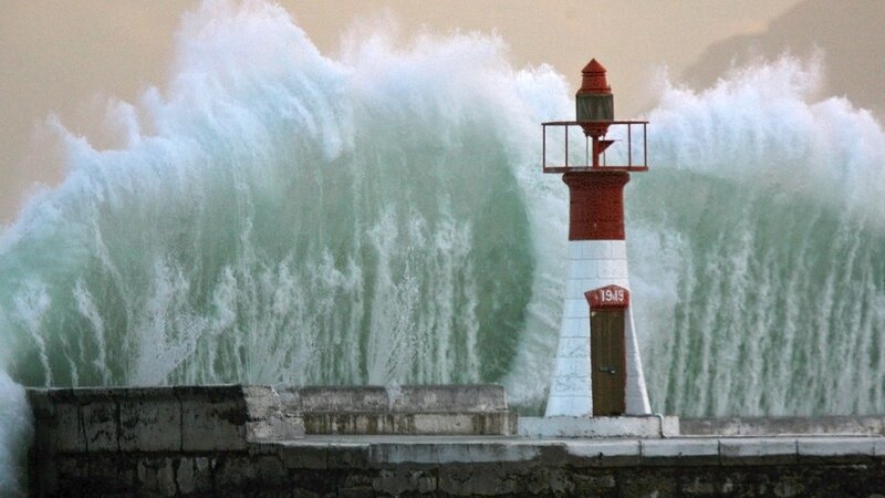 Lighthouse with crashing waves