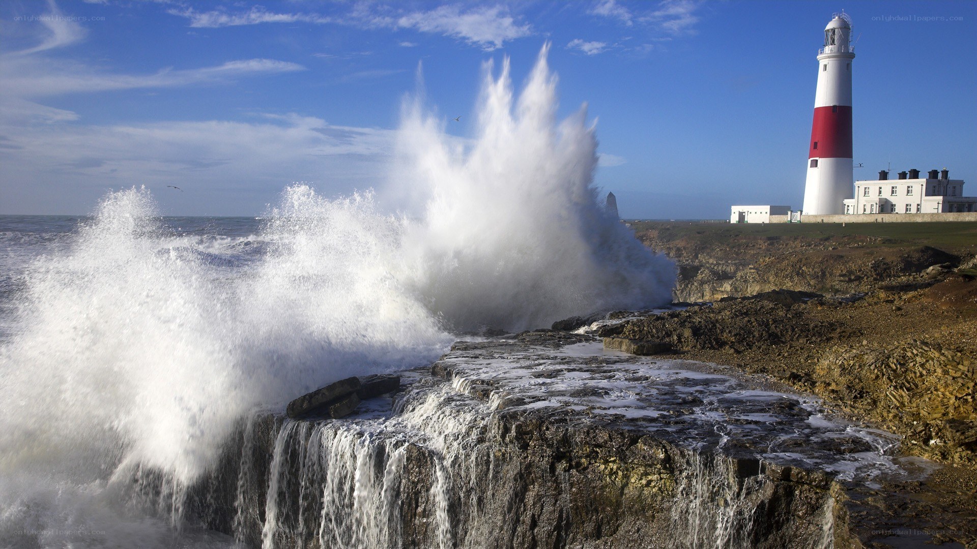 Lighthouse with crashing waves