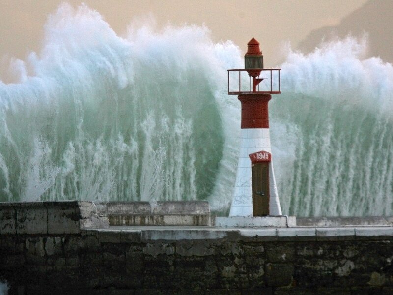 Lighthouse with crashing waves