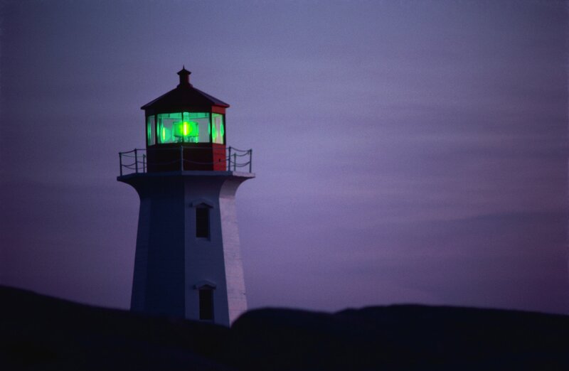 lighthouse with green light