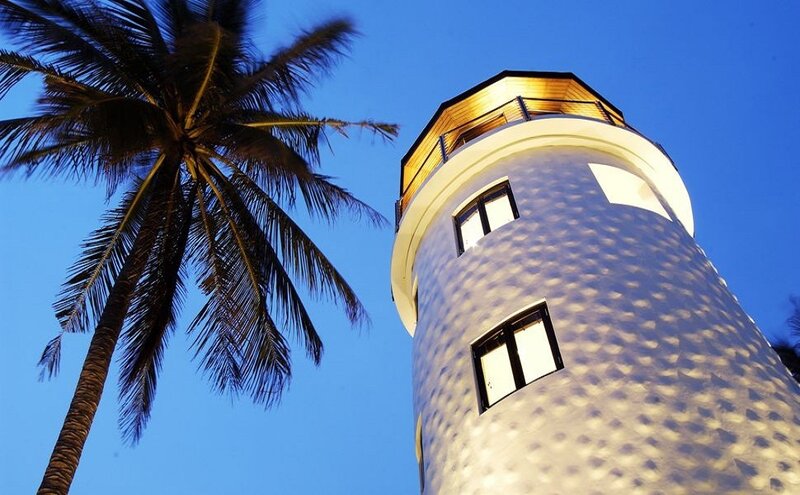 Lighthouse with Palm Tree
