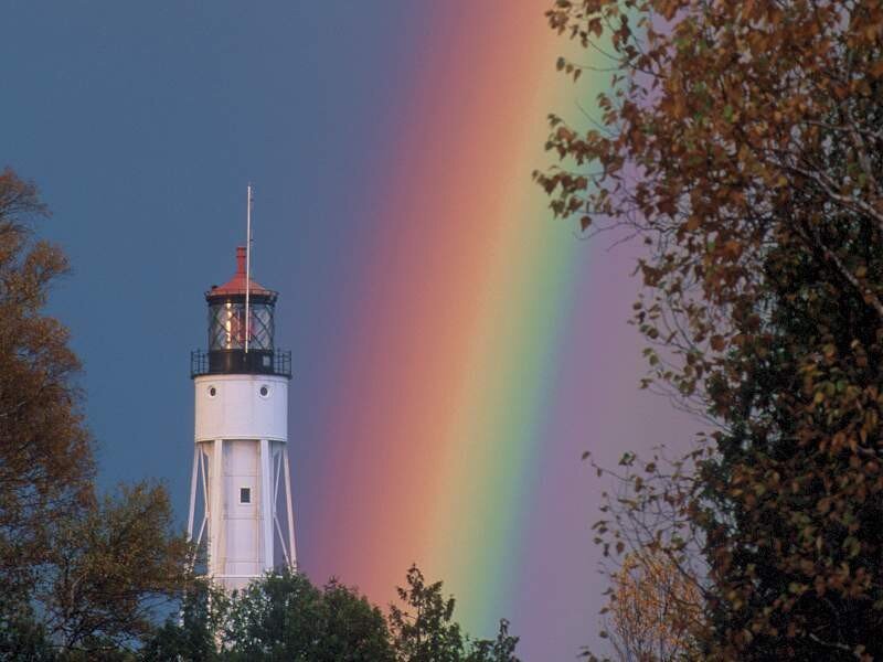 lighthouse with rainbow