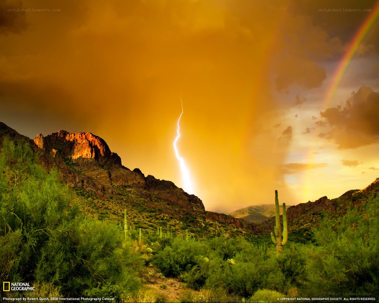 Lightning and rainbow over desert