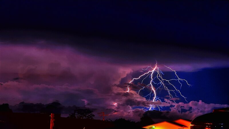 Lightning Bolt over Houses