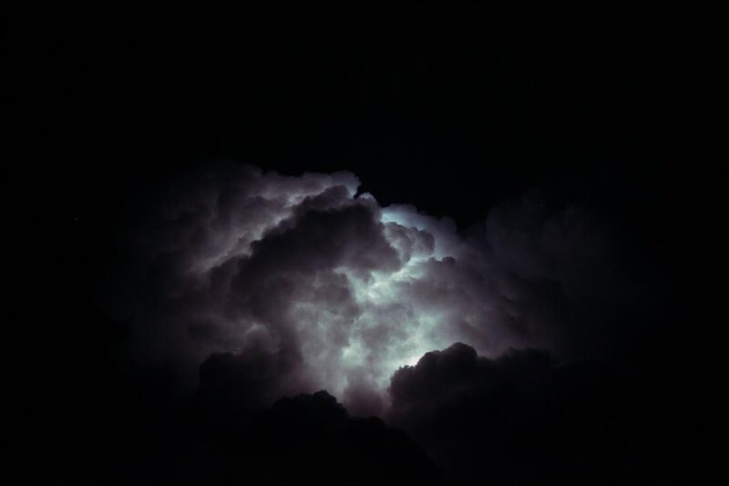 Lightning illuminates storm clouds