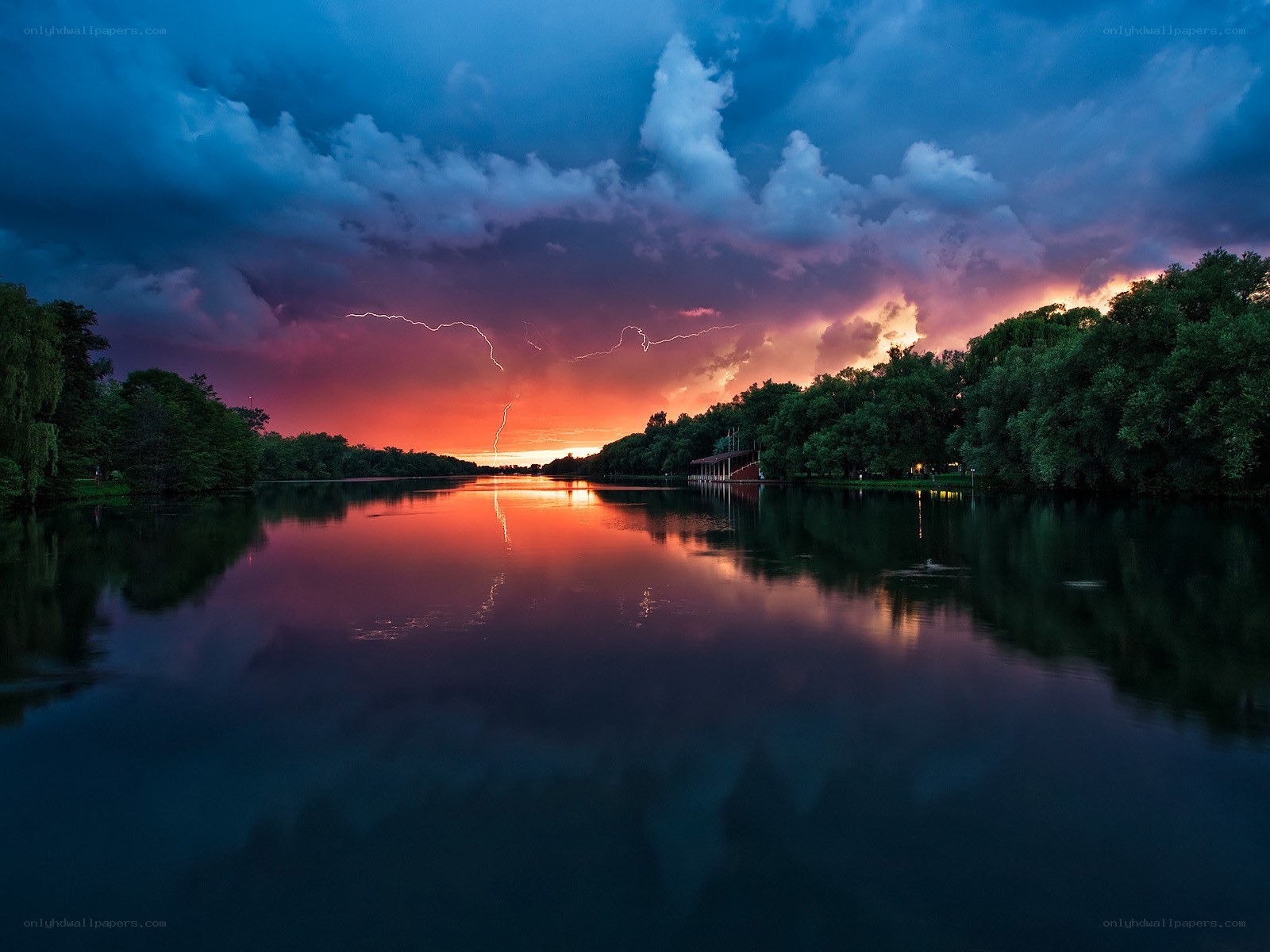 Lightning over a calm lake