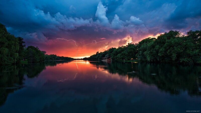 Lightning over a calm lake