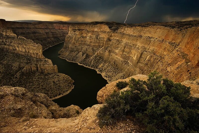 Lightning over a canyon river