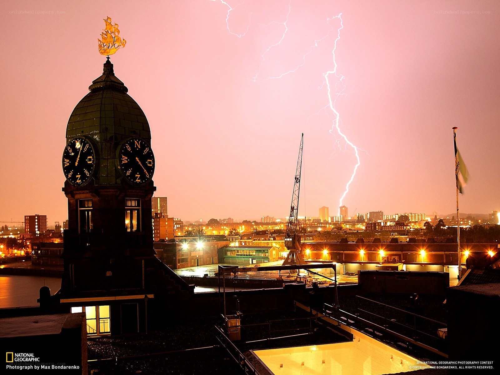 Lightning over a city at dusk