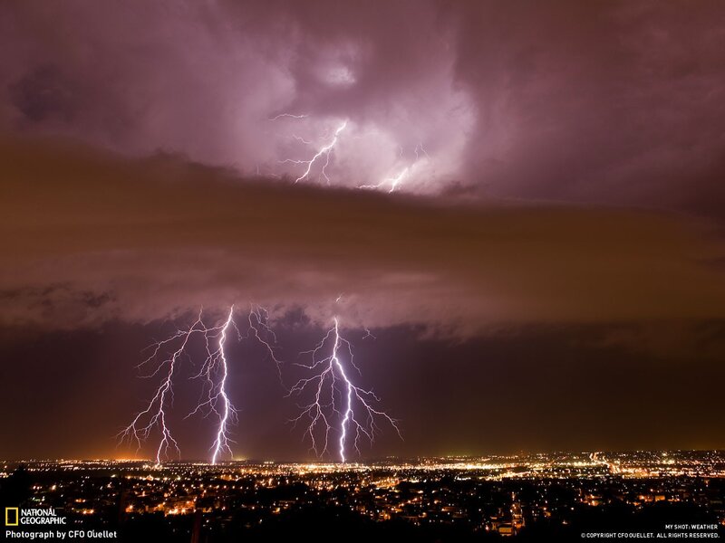 Lightning over a city at night