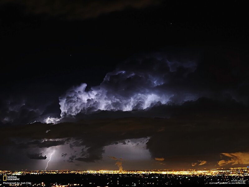 Lightning over a city at night