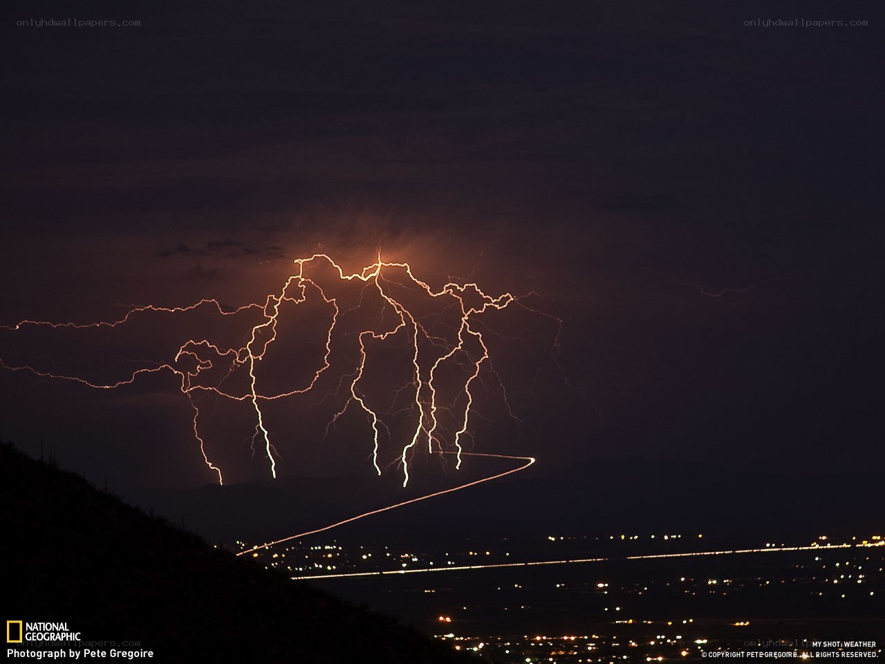 Lightning over a city at night