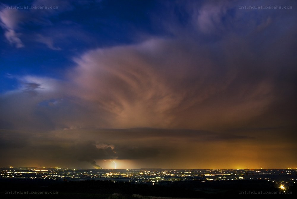 Lightning over a city at night