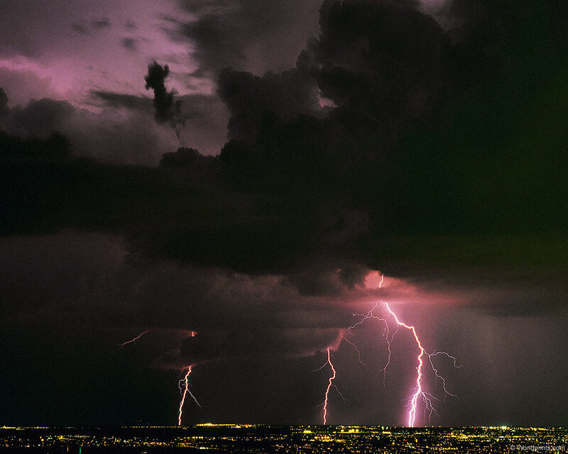 Lightning over a city at night