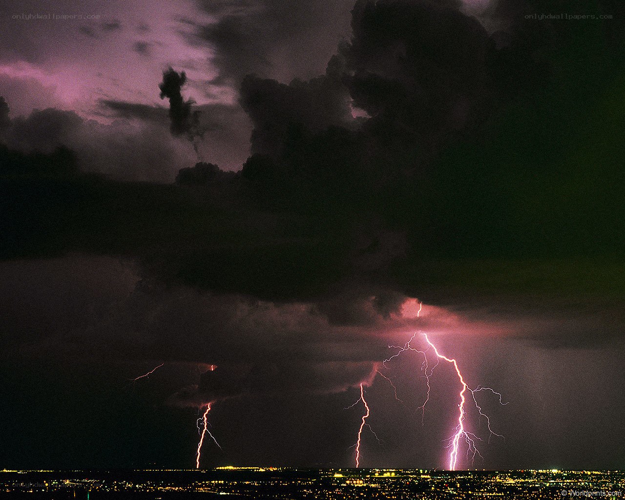 Lightning over a city at night