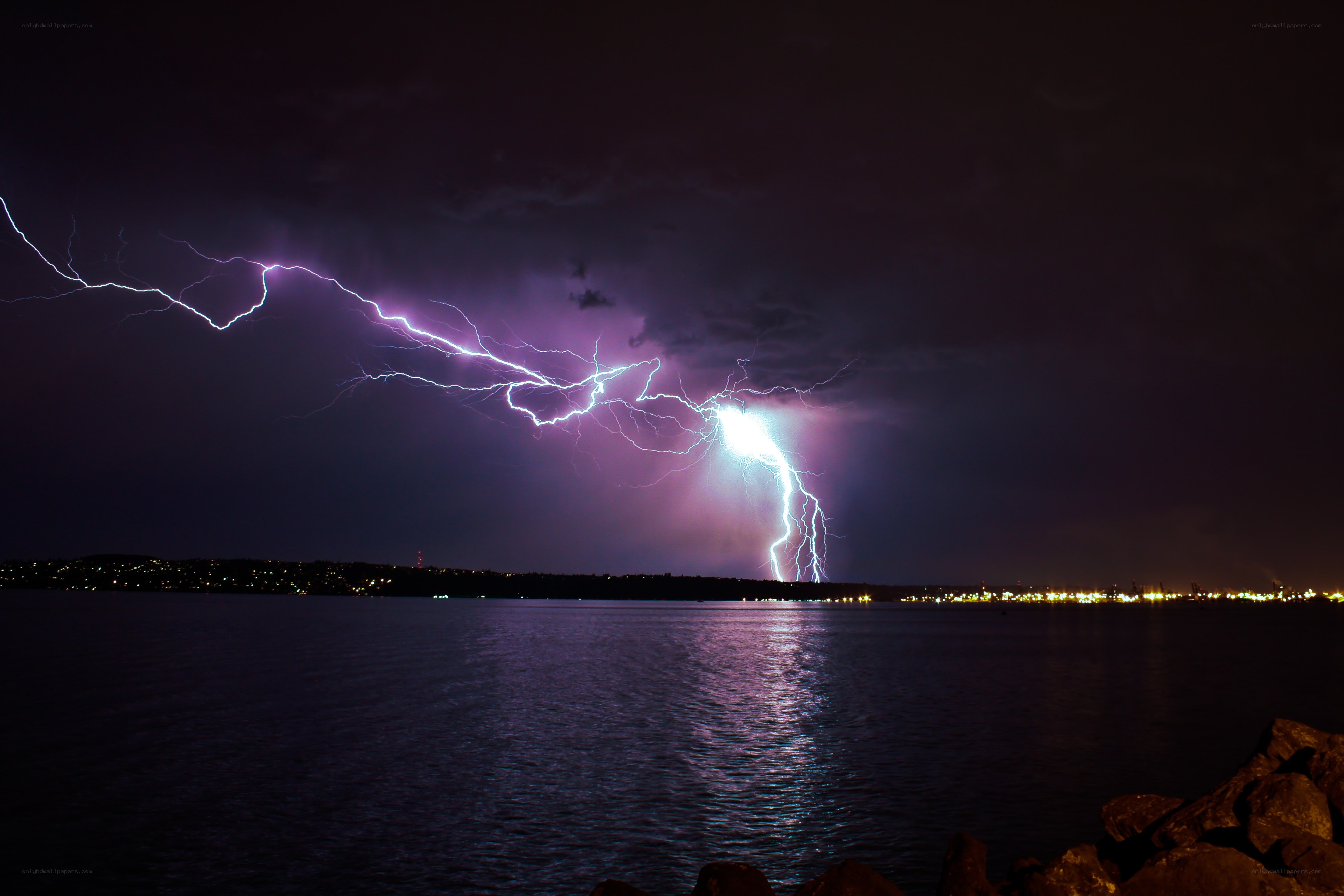 Lightning over a city at night