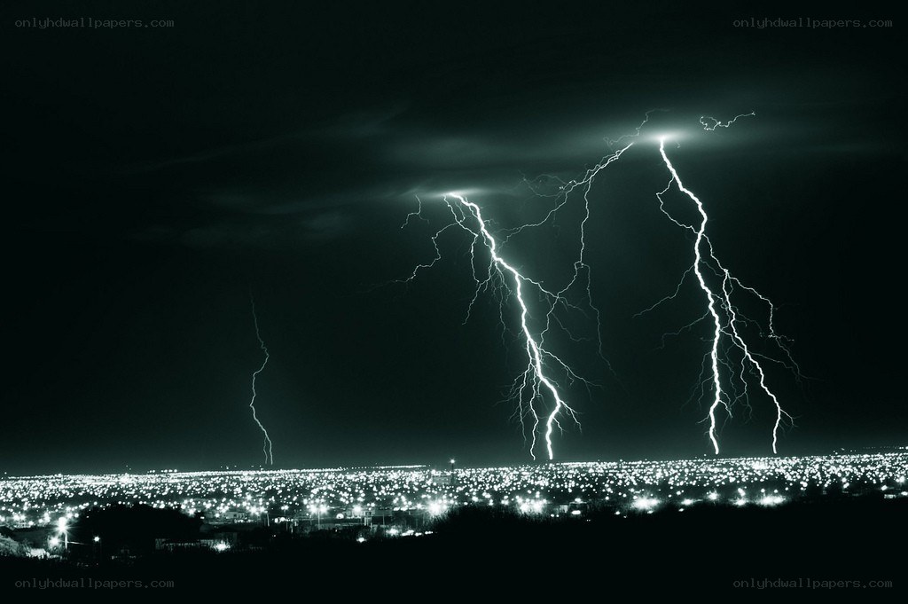 Lightning over a city at night