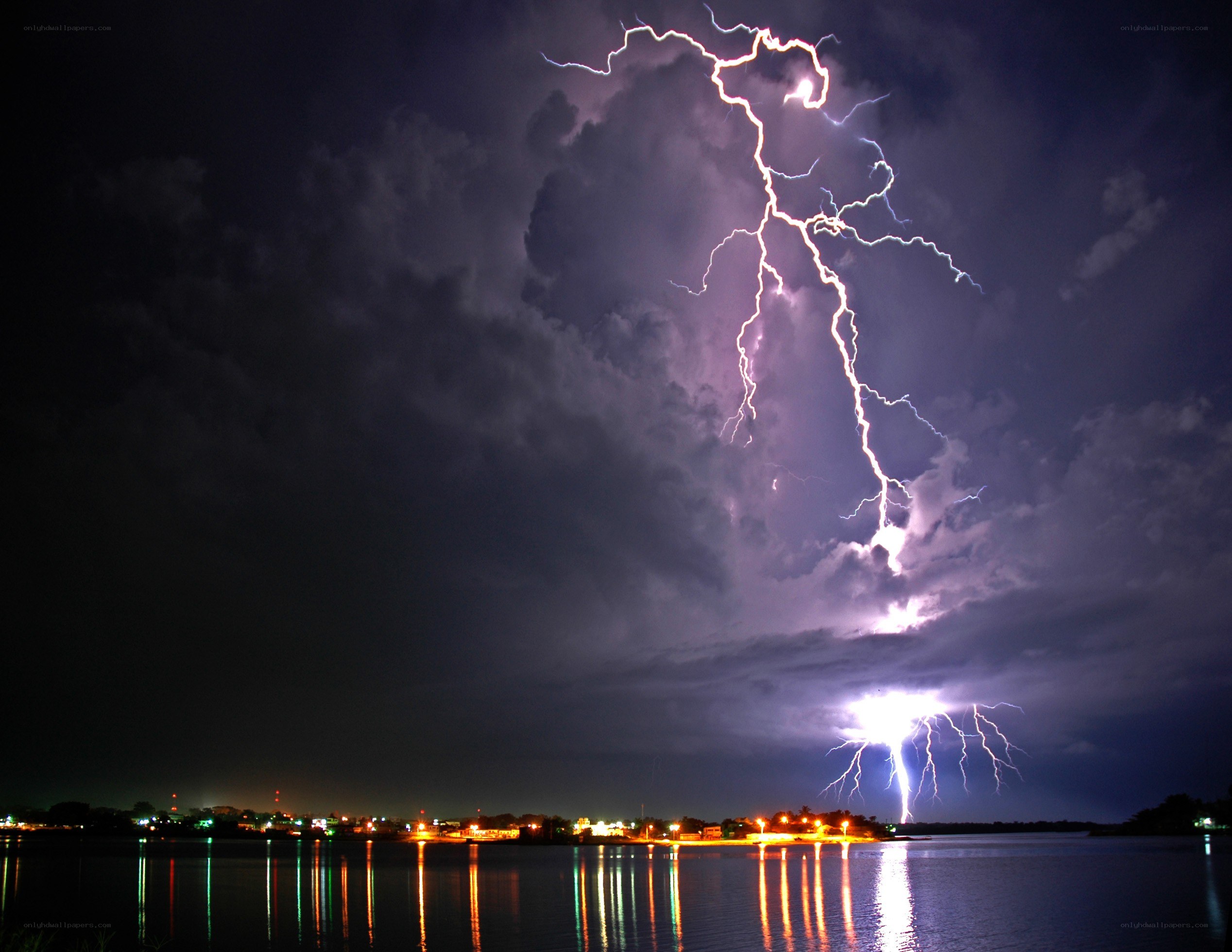 Lightning over a city at night