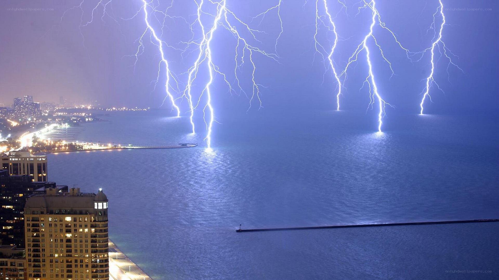 Lightning over a city lake