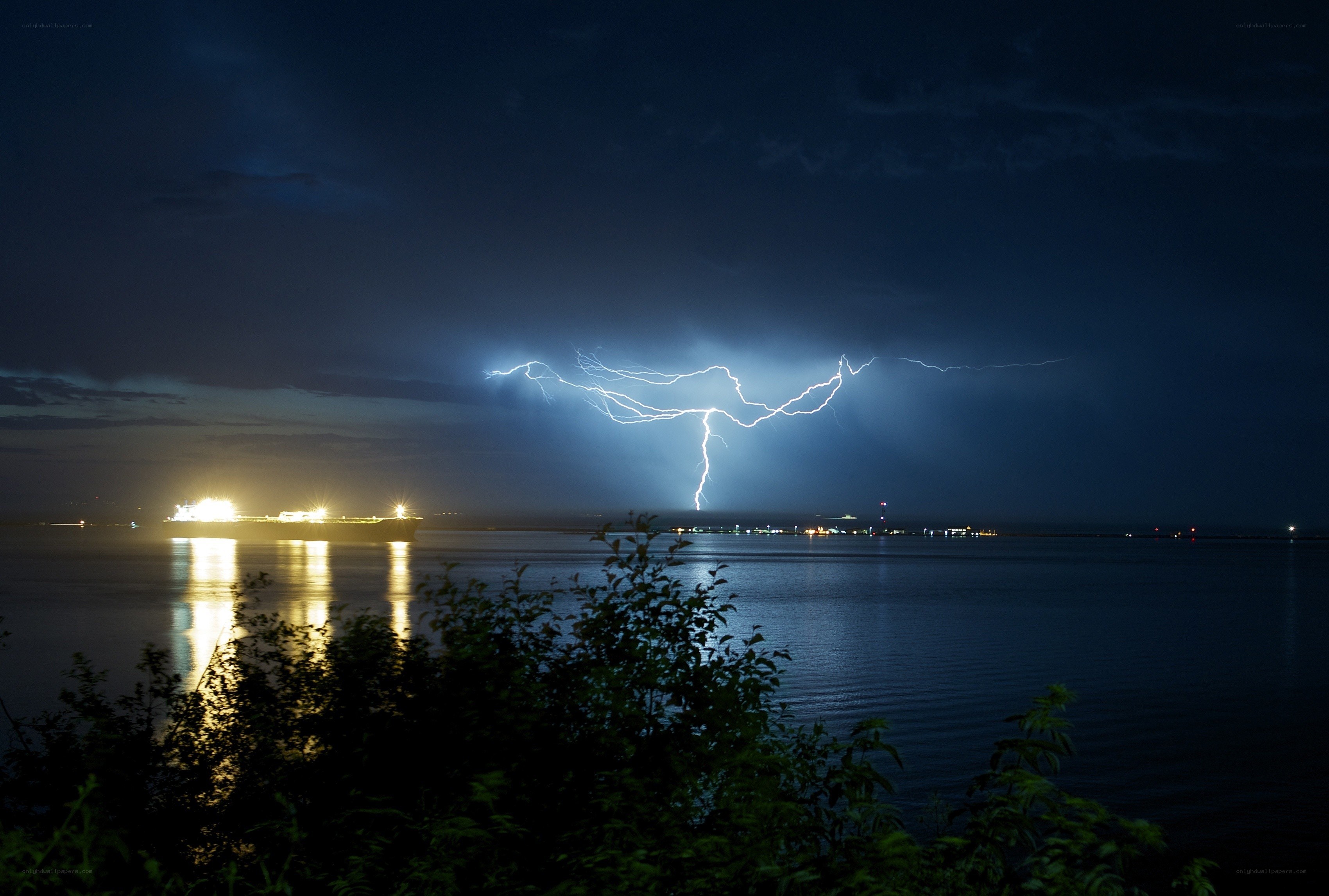 Lightning over a coastal city