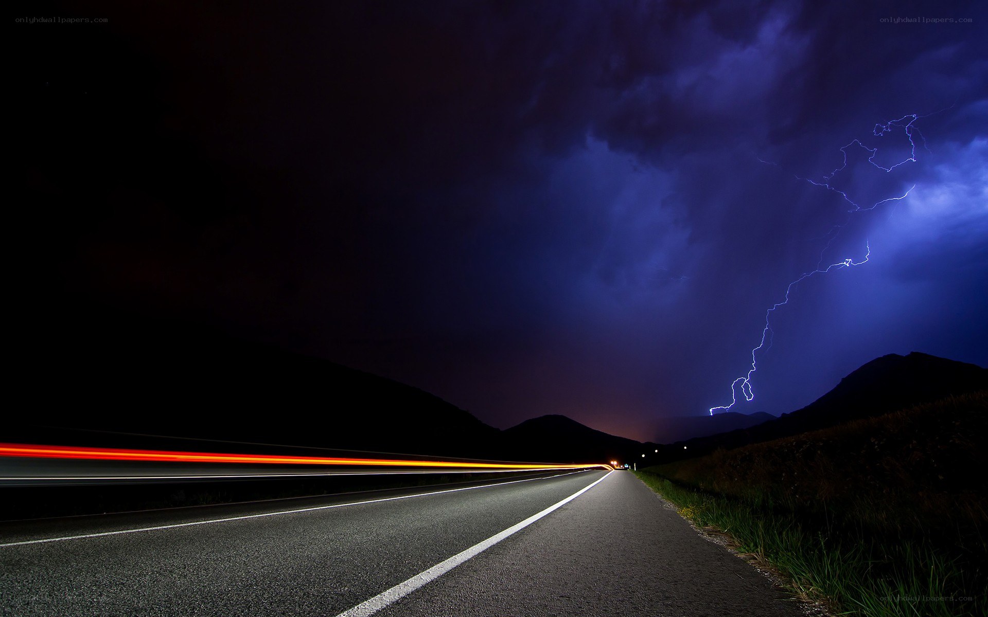 Lightning over a dark road