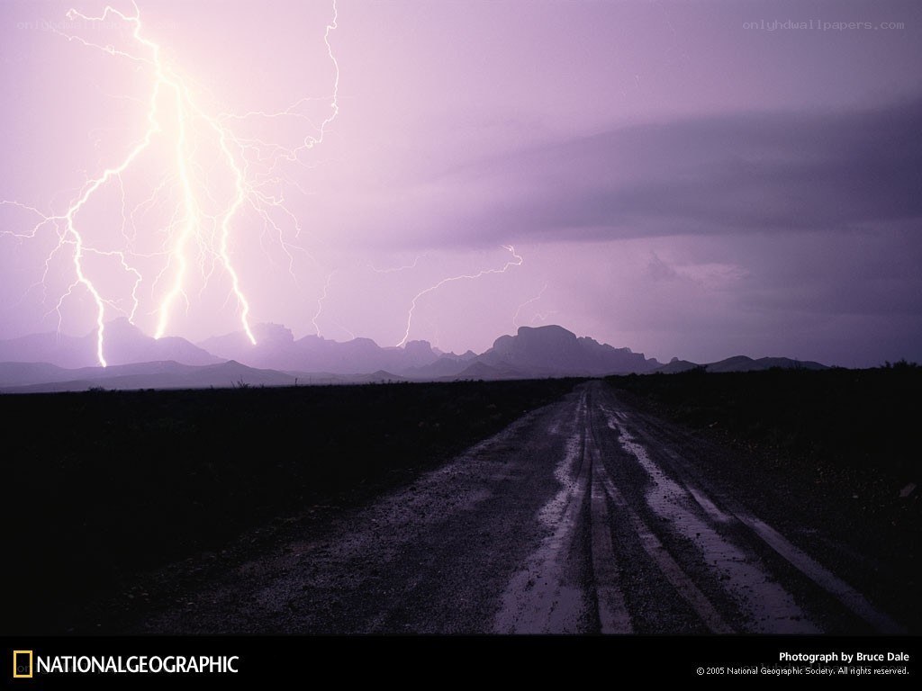 Lightning over a desert road